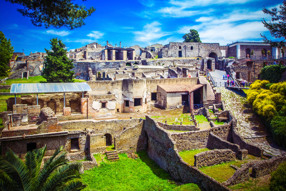 Ancient street in Pompeii with original stepping stones used by Romans to cross the road